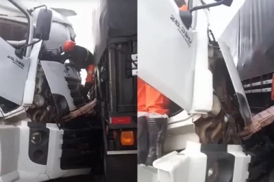 Motorista fica preso em ferragens após batida entre carretas